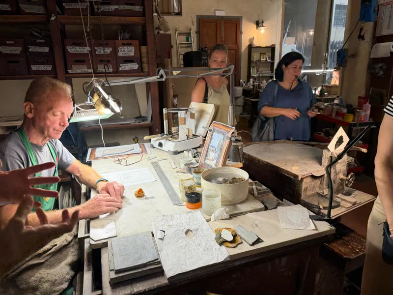 A Florentine artisan explaining his craft to the group