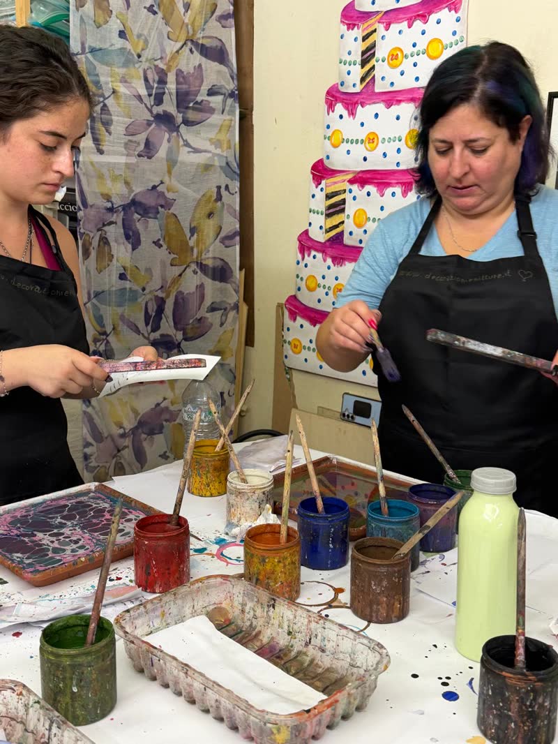 Women at the paper-marbling workshop