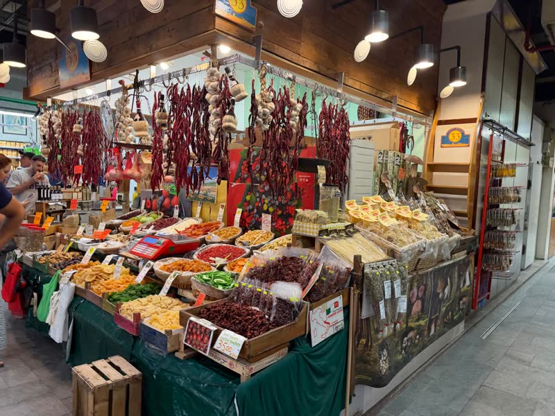 A stall of chili peppers and spices at a Florence market