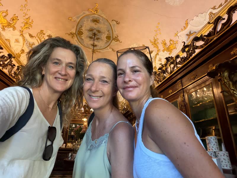 Shira Brand in a historic shop with a painted ceiling